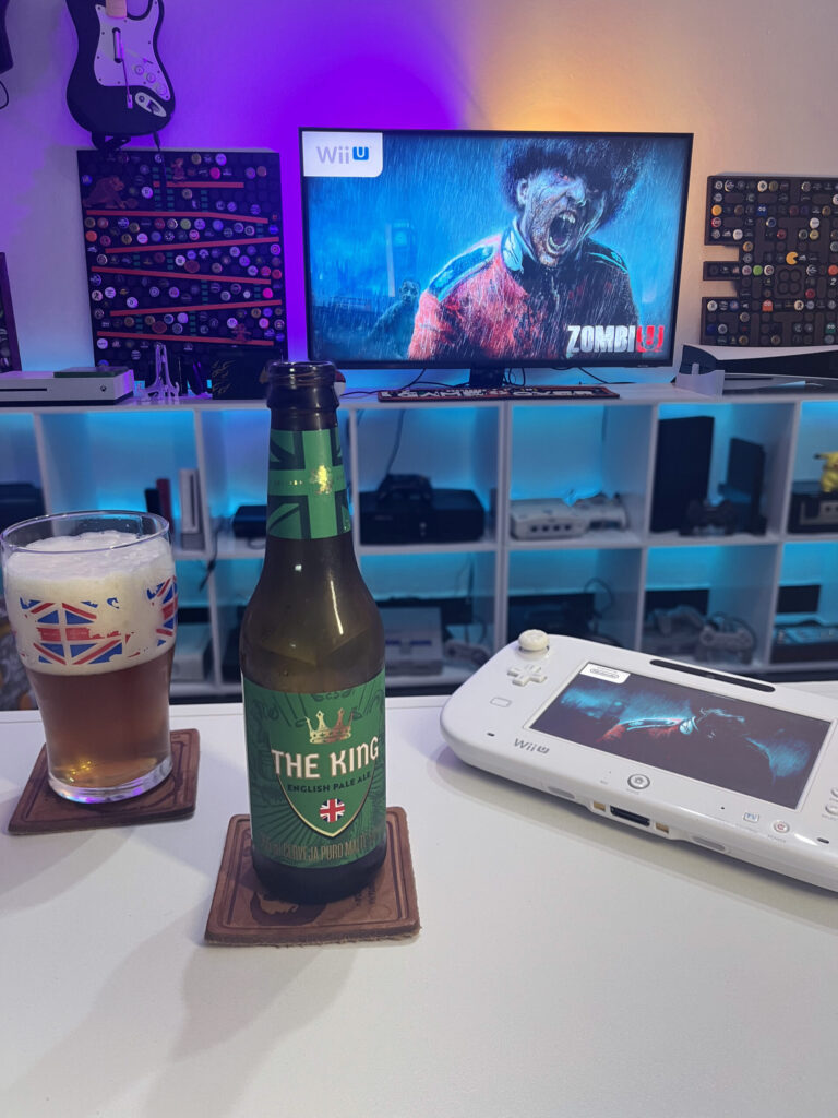 Cerveja The King da Caixa da Alegria ao lado de ZombiU