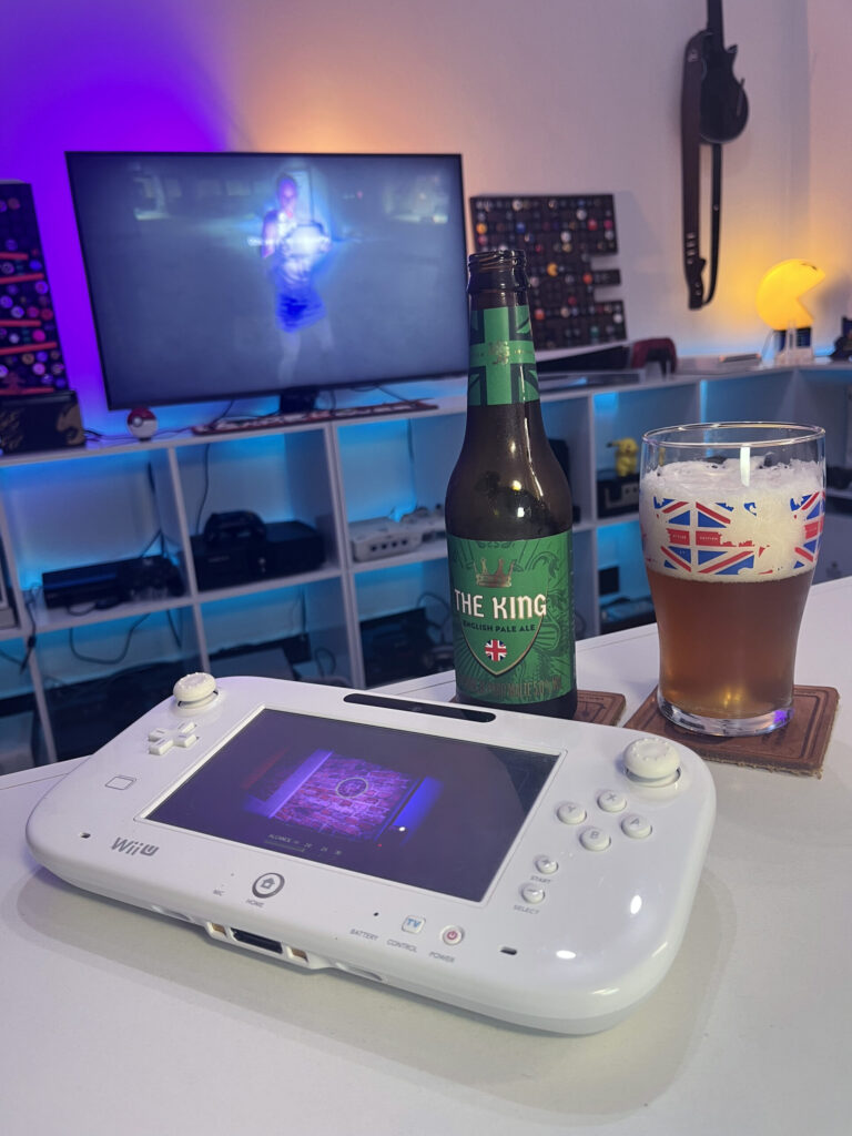 Cerveja The King da Caixa da Alegria ao lado de ZombiU