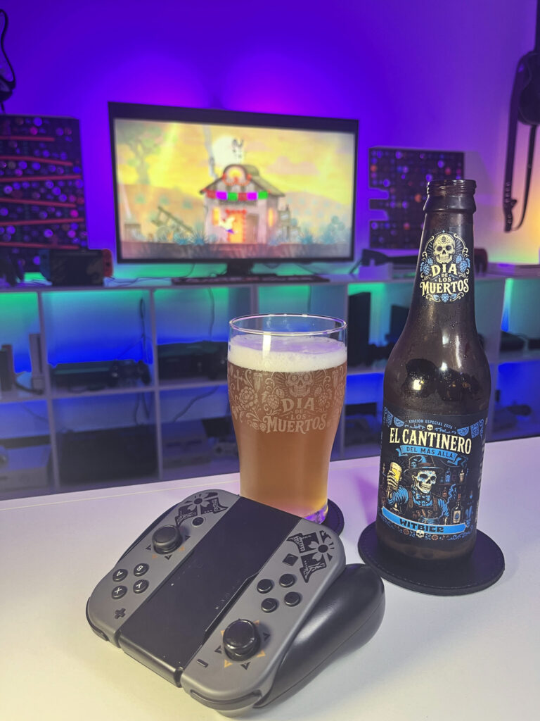 Cerveja Witbier palha turva ao lado de Guacamelee Super Turbo Championship Edition no Nintendo Switch em clima de Dia de los Muertos.