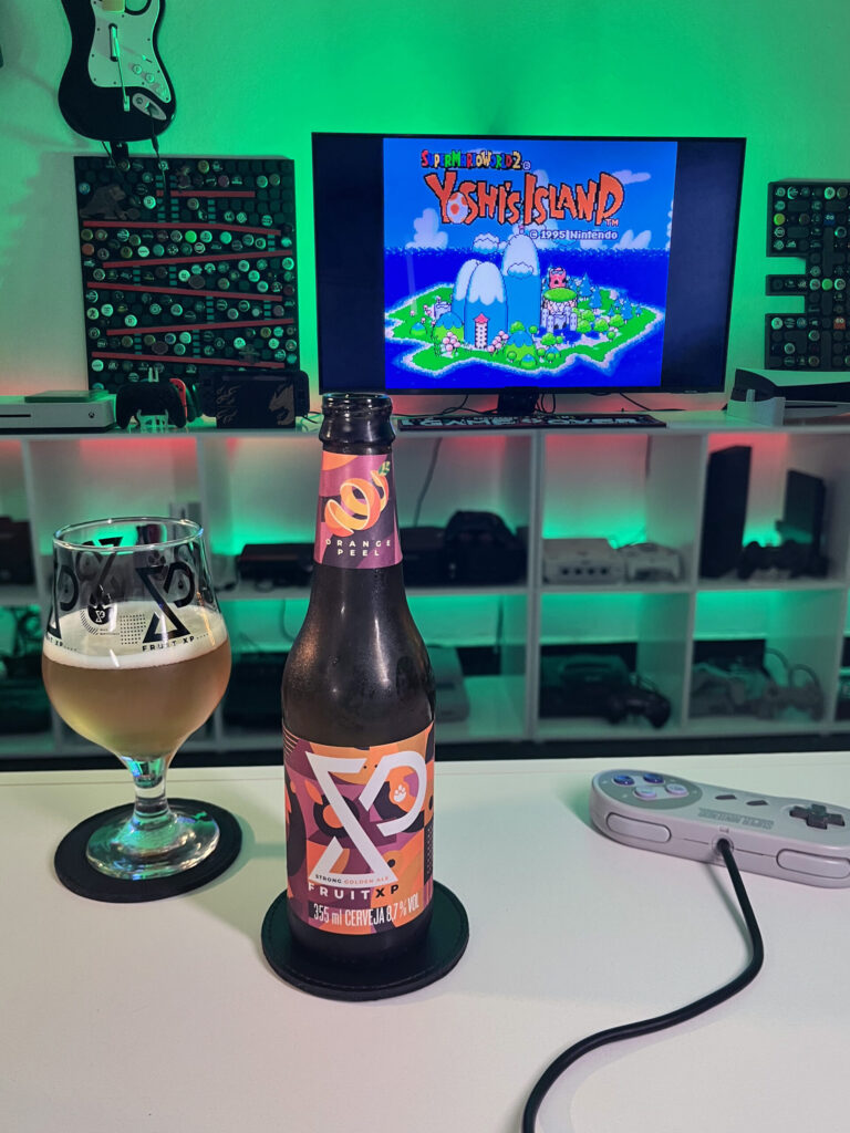 Cerveja dourada intensa ao lado de gameplay colorido de Yoshi's Island no Super Nintendo.