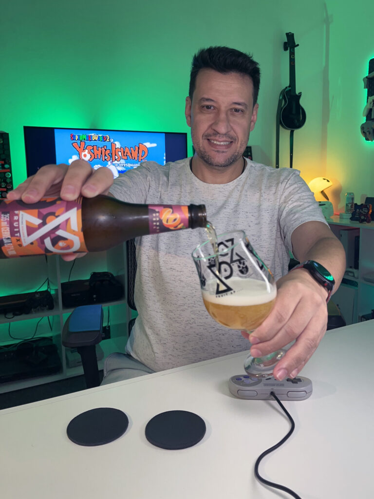 Cerveja dourada intensa ao lado de gameplay colorido de Yoshi's Island no Super Nintendo.