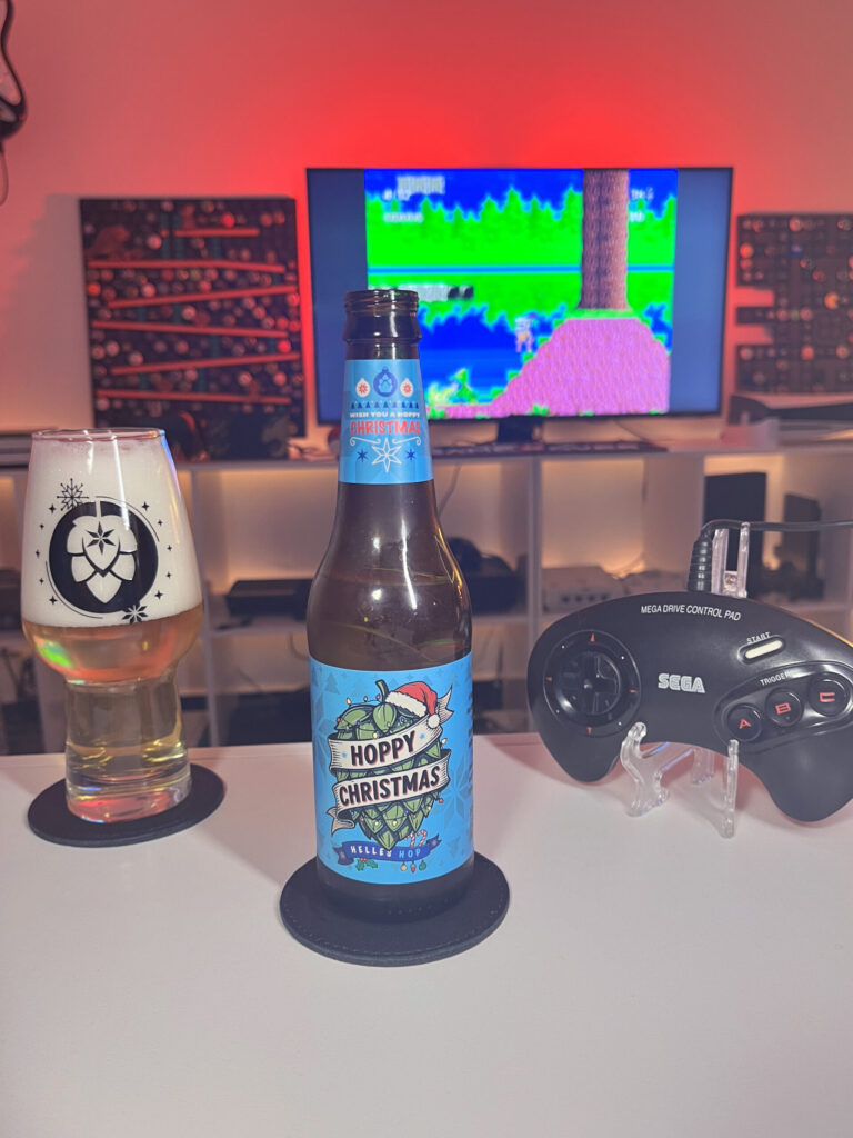 Cerveja Helles amarelo claro ao lado de Kid Chameleon no Mega Drive em clima de aventura leve.