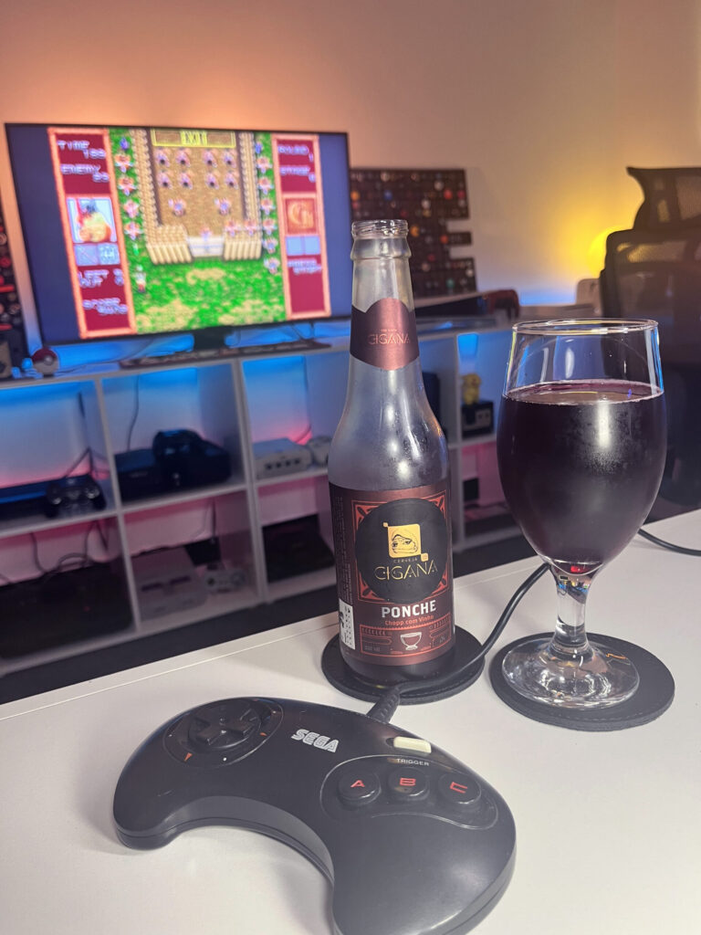 Cerveja rubi Chopp com vinho ao lado de Gain Ground no Mega Drive em clima de estratégia.
