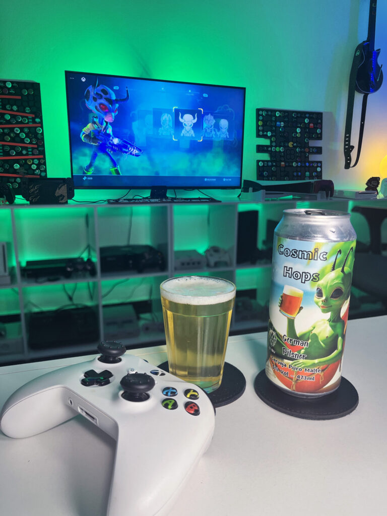 Cerveja German Pilsner amarelo claro ao lado de Destroy All Humans no Xbox One em clima de invasão alienígena.