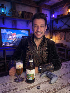 Cerveja Pilsen dourada e cristalina ao lado de Assassin's Creed Black Flag Resynced no PS5 em clima de pirataria.