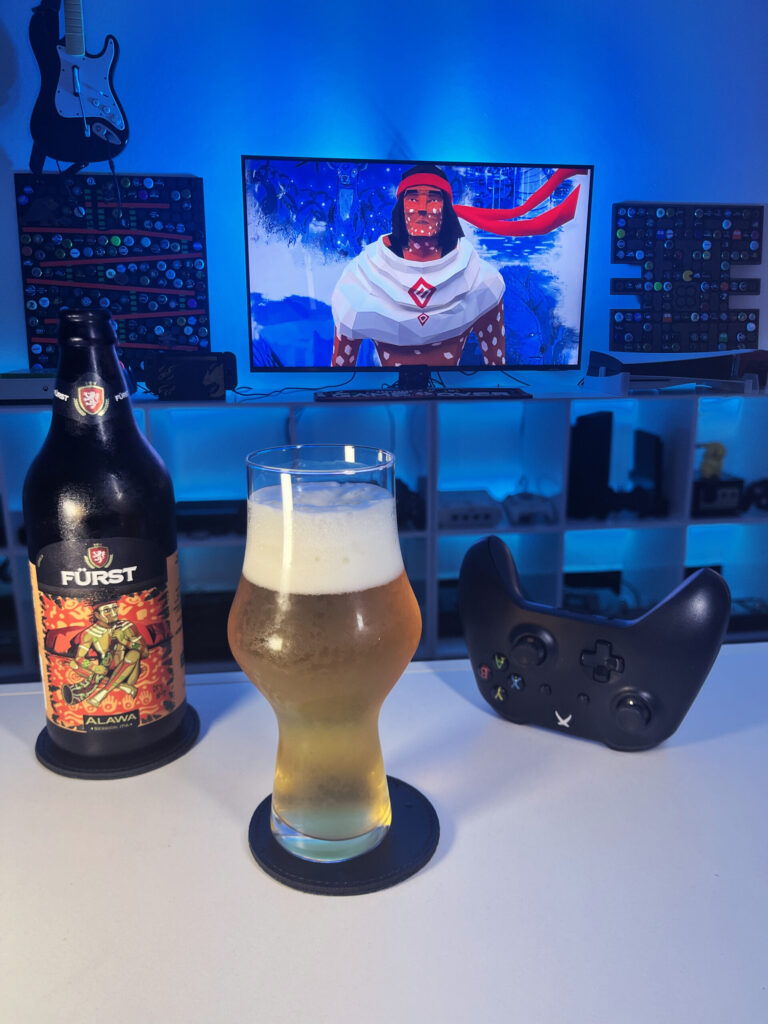 Cerveja Session IPA dourada ao lado de Mulaka no Xbox One em clima de jornada xamânica Tarahumara.