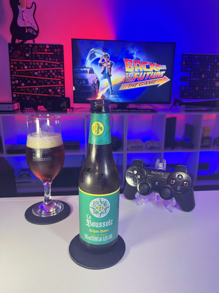 Belgian Dubbel da Caixa da Alegria ao lado de De Volta para o Futuro The Game no PlayStation 3.