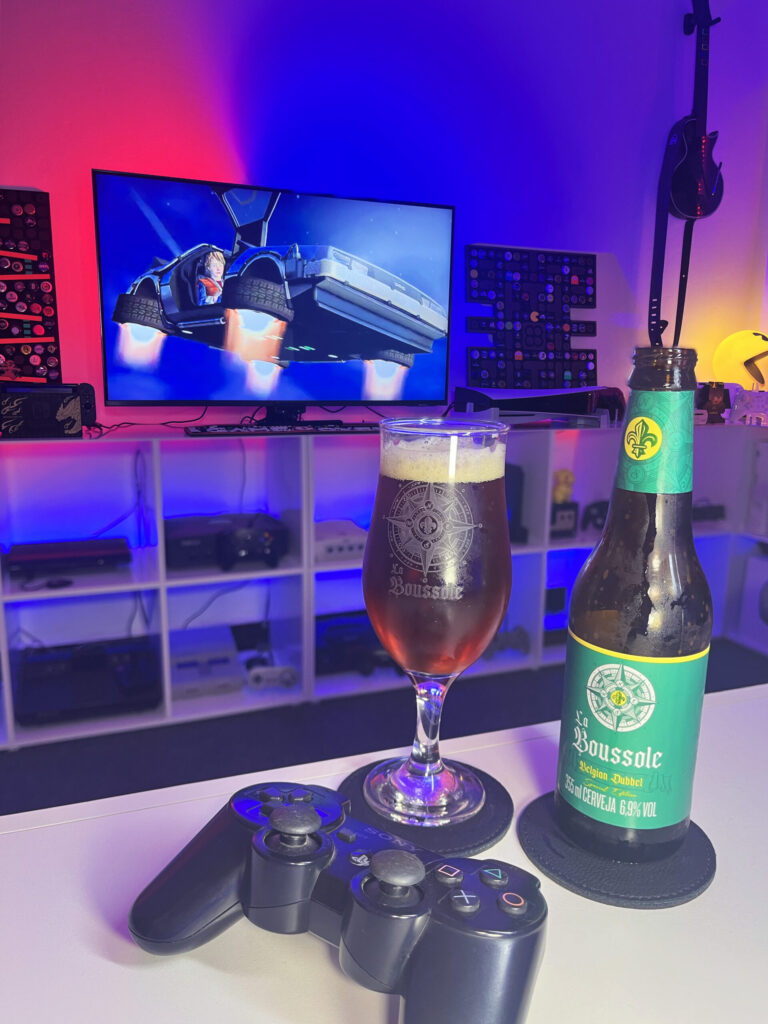 Belgian Dubbel da Caixa da Alegria ao lado de De Volta para o Futuro The Game no PlayStation 3.