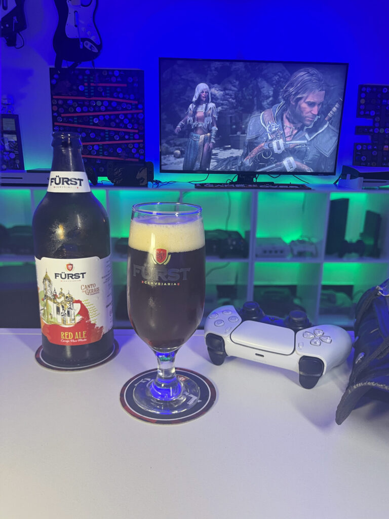 Cerveja Red Ale ao lado de Assassin's Creed Black Flag Resynced no PS5.