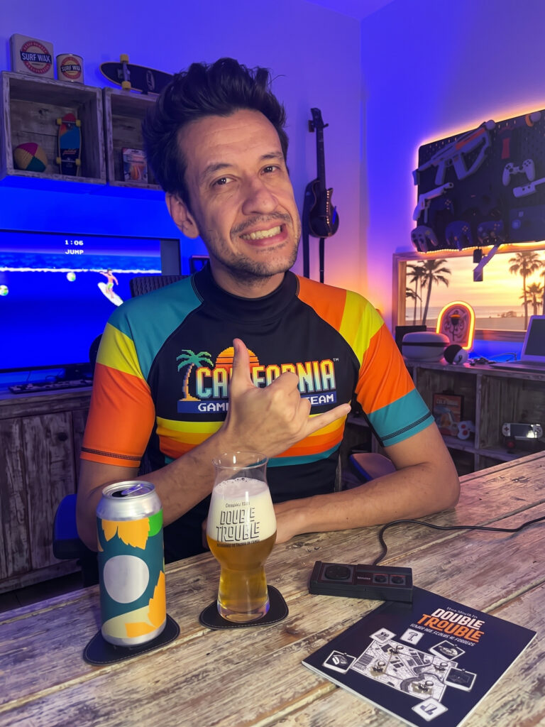 Cerveja West Coast IPA dourada ao lado de California Games no Master System 3 em clima de verão.